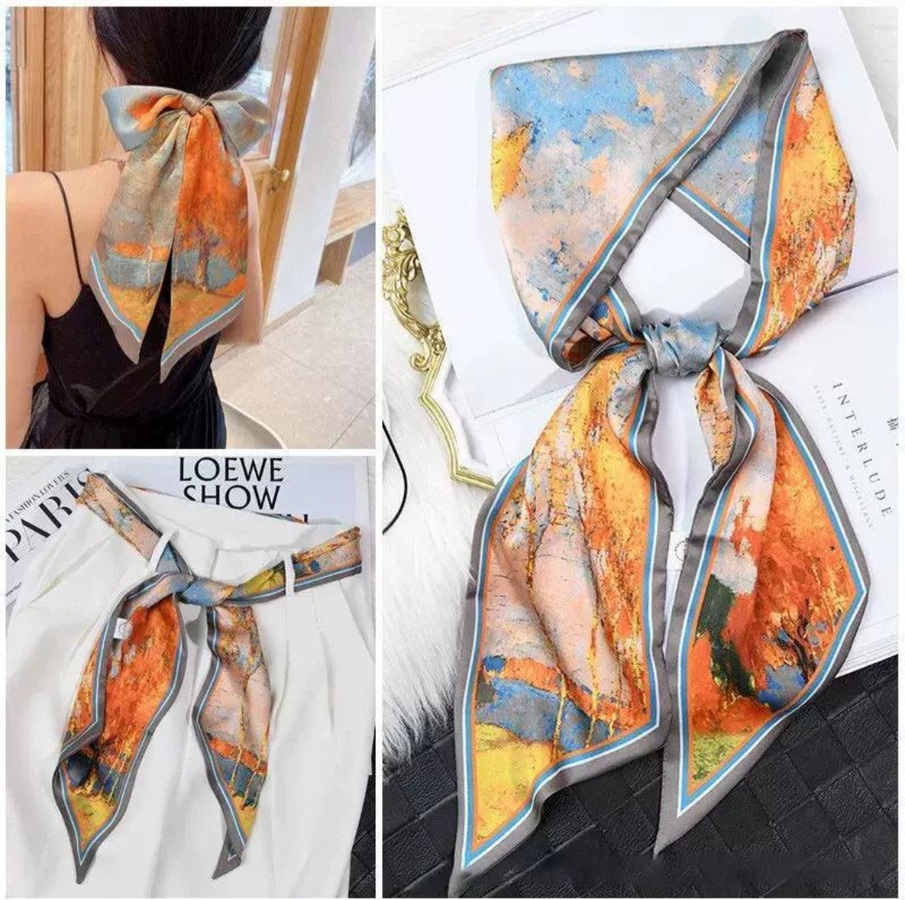 Pañuelo elegante con estampado artístico en tonos naturales